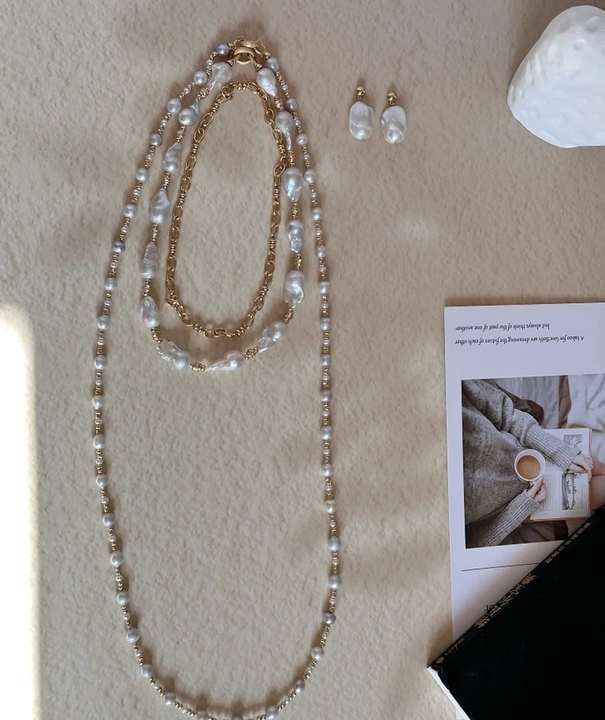 The complete Freshwater Baroque Pearl Set in a warm still life