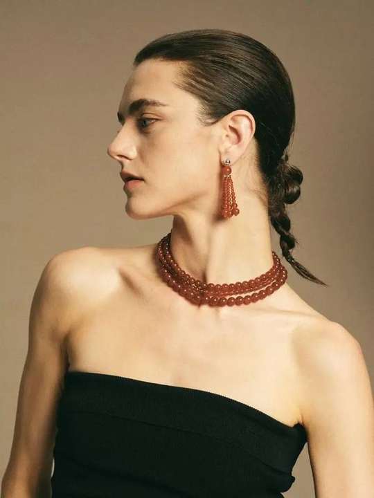 Red agate necklace worn in layers