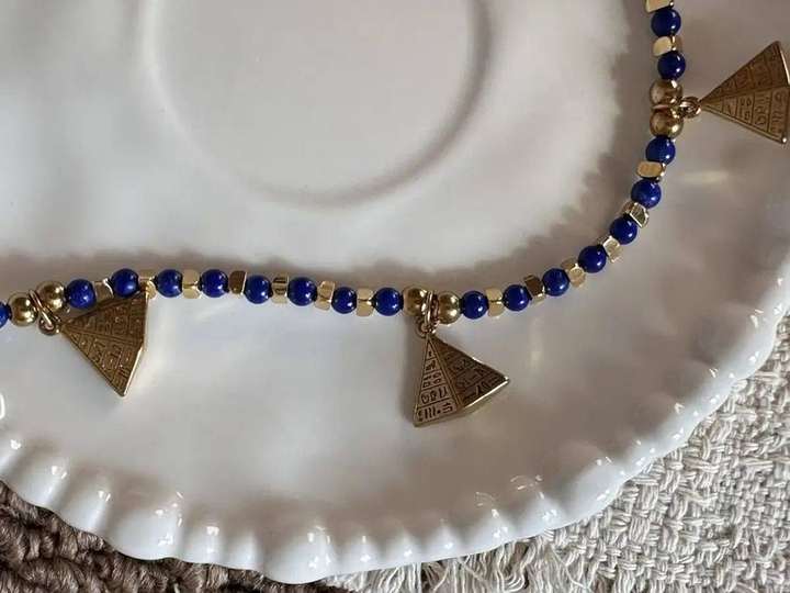 Pyramid pendants and lapis chain detail