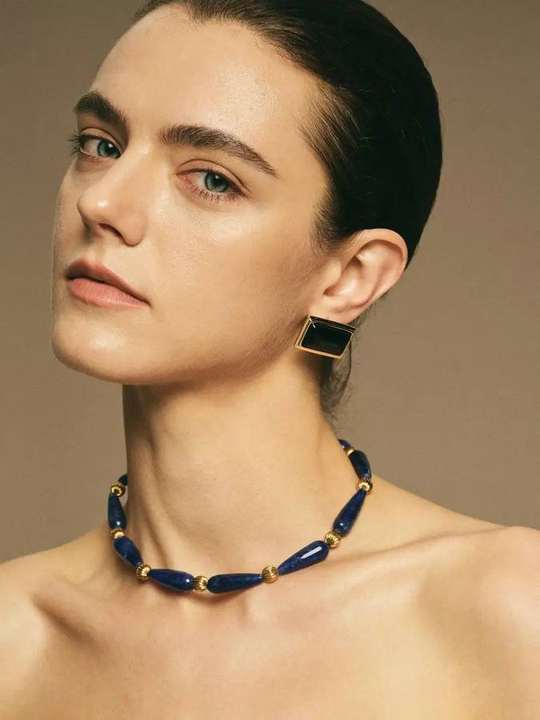 Minimalist lapis lazuli and black agate set worn by model