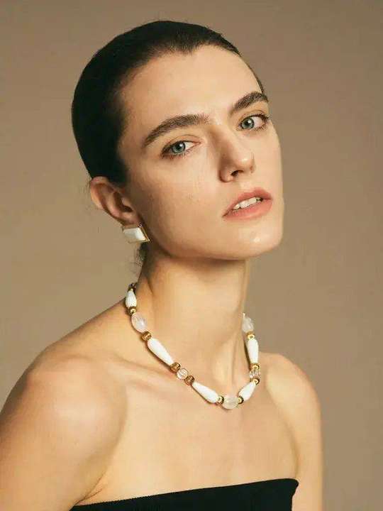 White agate teardrop choker and square white agate stud earrings worn by model
