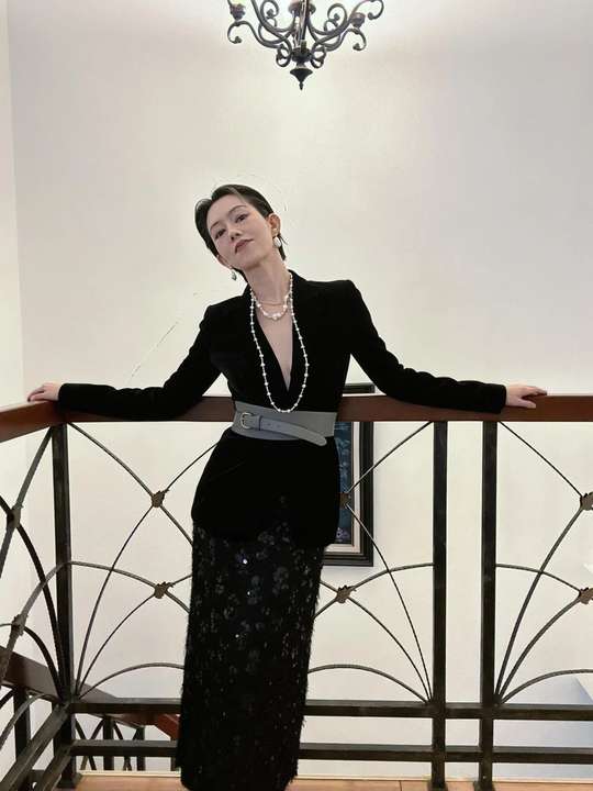 Freshwater baroque pearl set in full-length black tailoring